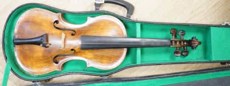 A cased violin. Label inside reads Copie de Pietro Antonius Dallas Costa fec in Treviso anno 17