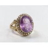 A Victorian style yellow metal, amethyst and seed pearl set oval dress ring, size N/O, gross