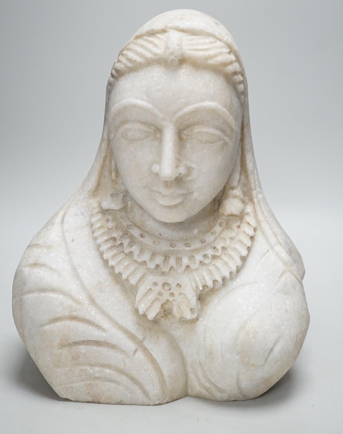 An Indian carved marble bust, 31cm