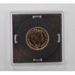 An Elizabeth II cased 2015 gold sovereign.