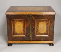 A 19th century rosewood and bird’s eye maple table cabinet. 24cm high. 32cm wide, 23cm deep