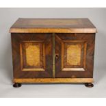 A 19th century rosewood and bird’s eye maple table cabinet. 24cm high. 32cm wide, 23cm deep