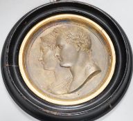 After Bertrand Andrieu (1761-1822). A framed circular gilt brass relief plaque of Napoleon Bonaparte
