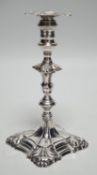 A George III cast silver taper stick, with turned knopped stem and engraved crest, maker, JH,