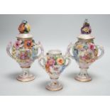 Three 19th century Dresden floral encrusted vases, two with covers, 16cm