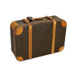 A 1980/90s Louis Vuitton canvas monogram suitcase, with calf leather straps and brass hardware,