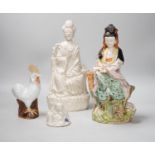 A Chinese enamelled blanc de chine figure of Guanyin, together with three other figures. 28cm tall