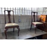 A pair of 18th century oak and walnut dining chairs