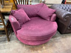 A Heals Bella 'twister' armchair, width 128cm, height 65cm