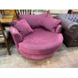 A Heals Bella 'twister' armchair, width 128cm, height 65cm