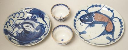 Two 19th century Chinese blue and white dishes and two 18th century tea bowls, largest 23cm
