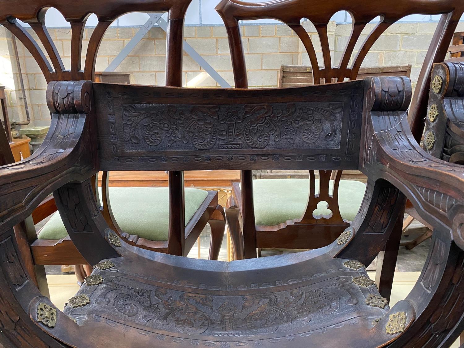 A pair of 19th century Spanish embossed leather and carved walnut framed 'X' framed armchairs, width - Image 2 of 3