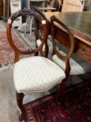 A set of six Victorian walnut balloon back dining chairs
