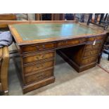 A reproduction George III style mahogany pedestal partner's desk, width 152cm, depth 91cm, height