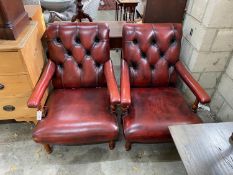 A pair of Victorian style button back burgundy leather Howard style open armchairs, width 69cm,