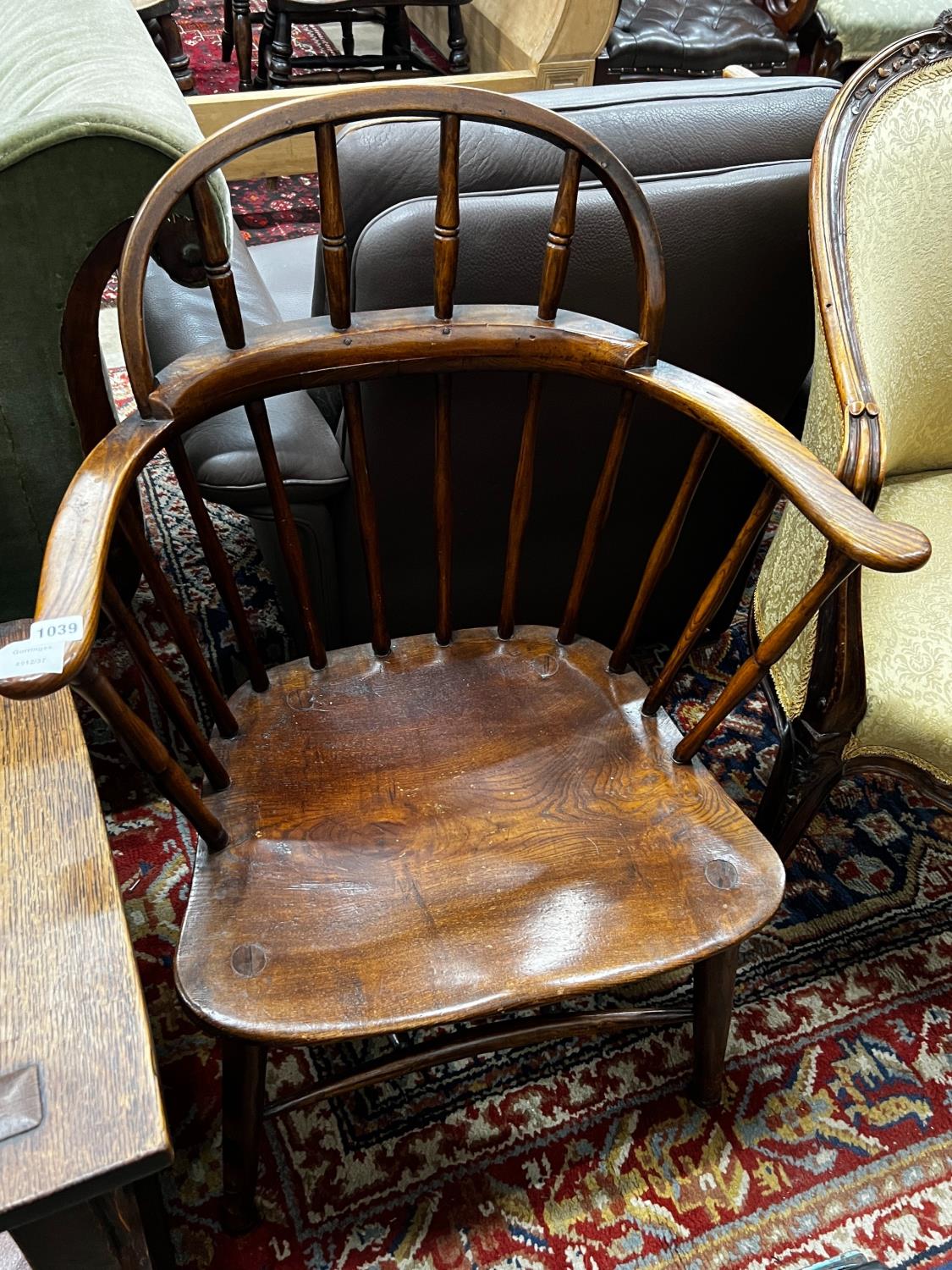 An early 20th century Windsor ash and elm comb back elbow chair, width 66cm, depth 41cm, height