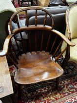 An early 20th century Windsor ash and elm comb back elbow chair, width 66cm, depth 41cm, height