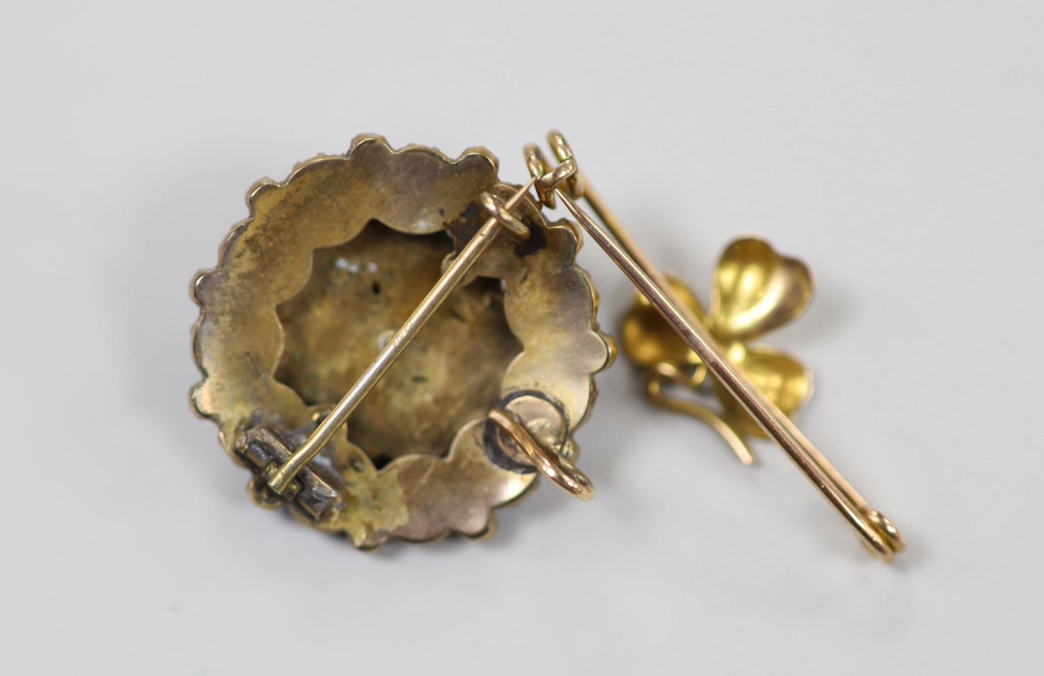 A yellow metal 'shamrock' bar brooch, 36mm, 1.6 grams and a late Victorian gilt white metal and - Image 3 of 3