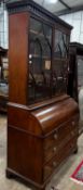 A George III mahogany cylinder bureau bookcase with glazed panelled doors, width 115cm, depth