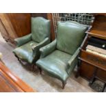 A pair of Victorian studded green leather library chairs on cabriole legs, width 69cm, depth 70cm,