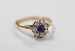 A yellow metal, sapphire and diamond set cluster ring, size N, gross weight 2.2 grams.
