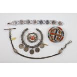 Two white metal and Scottish hardstone set brooches, largest 51mm, two coin set bracelet and a fob