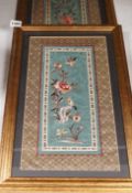 A pair of framed Chinese embroideries with bird and flower decoration, 34 x 14cm