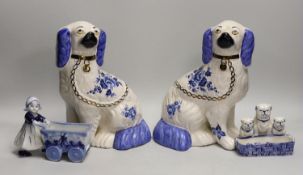 A pair of Staffordshire style comforter spaniels and two other items