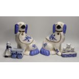 A pair of Staffordshire style comforter spaniels and two other items