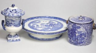 Blue and white pottery- A Victorian Willow pattern comport, a biscuit barrel and an urn with cover