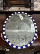 An oval Irish style wall mirror, width 41cm, height 51cm