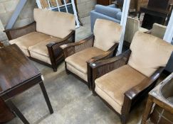 A 1930's oak and single caned three piece bergere suite