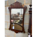 A George III style fret cut mahogany wall mirror, width 48cm, height 83cm
