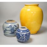 Two Chinese blue and white ginger jars, together with a large Chinese yellow glazed vase, tallest