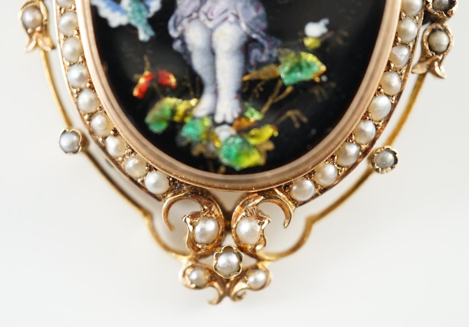 A Victorian oval gold and enamel pendant/brooch, painted with a cherub offering cherries to a - Image 3 of 4