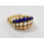 An early to mid 20th century yellow metal and graduated lapis lazuli, split pearl and coral set