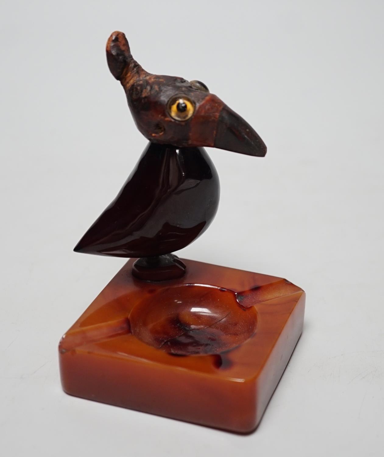 A cherry amber Bakelite and butterscotch phenolic YZ style bird ashtray, 10cm