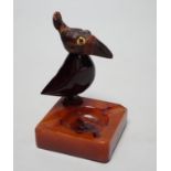 A cherry amber Bakelite and butterscotch phenolic YZ style bird ashtray, 10cm