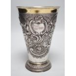 A 19th century Swiss? embossed parcel gilt white metal flared vase, maker's mark AWM, engraved