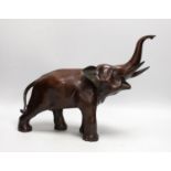 A 20th century patinated bronze model of an elephant, 29cm tall