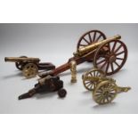 A bronze 'Napoleon bust' desk seal, 8.5cm tall, together with four models of cannons. Largest 39cm
