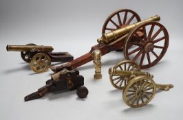 A bronze 'Napoleon bust' desk seal, 8.5cm tall, together with four models of cannons. Largest 39cm