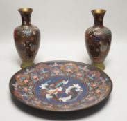 A Japanese cloisonné enamel dish, 30.5cm diameter and a pair of Japanese cloisonné enamel vases. (