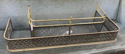 A Victorian pierced brass fender, length 121cm together with a smaller reproduction brass fender