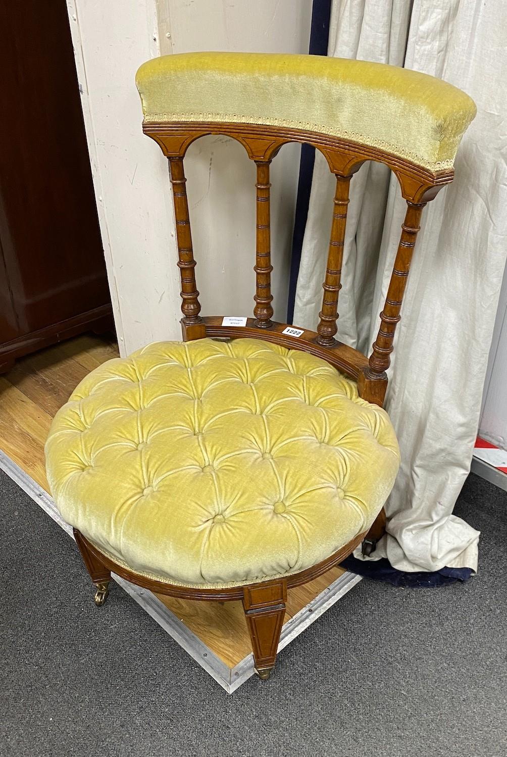 A late Victorian mahogany side chair with deep buttoned circular seat, width 54cm, height 79cm