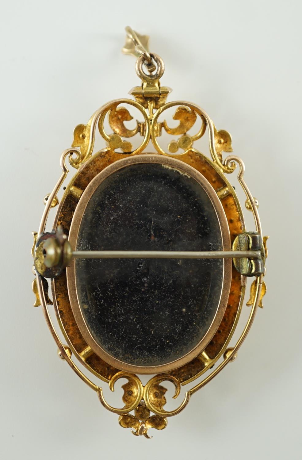 A Victorian oval gold and enamel pendant/brooch, painted with a cherub offering cherries to a - Image 4 of 4