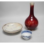 A Chinese sang de boeuf glazed bottle neck vase, together with a Chinese blue and white tea bowl,