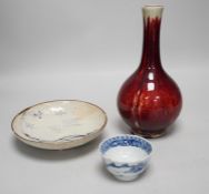 A Chinese sang de boeuf glazed bottle neck vase, together with a Chinese blue and white tea bowl,