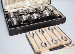 A cased George V ten piece silver condiment set, with four (ex 6) spoons, maker, RR, Birmingham,