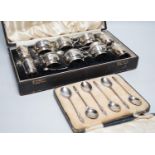 A cased George V ten piece silver condiment set, with four (ex 6) spoons, maker, RR, Birmingham,